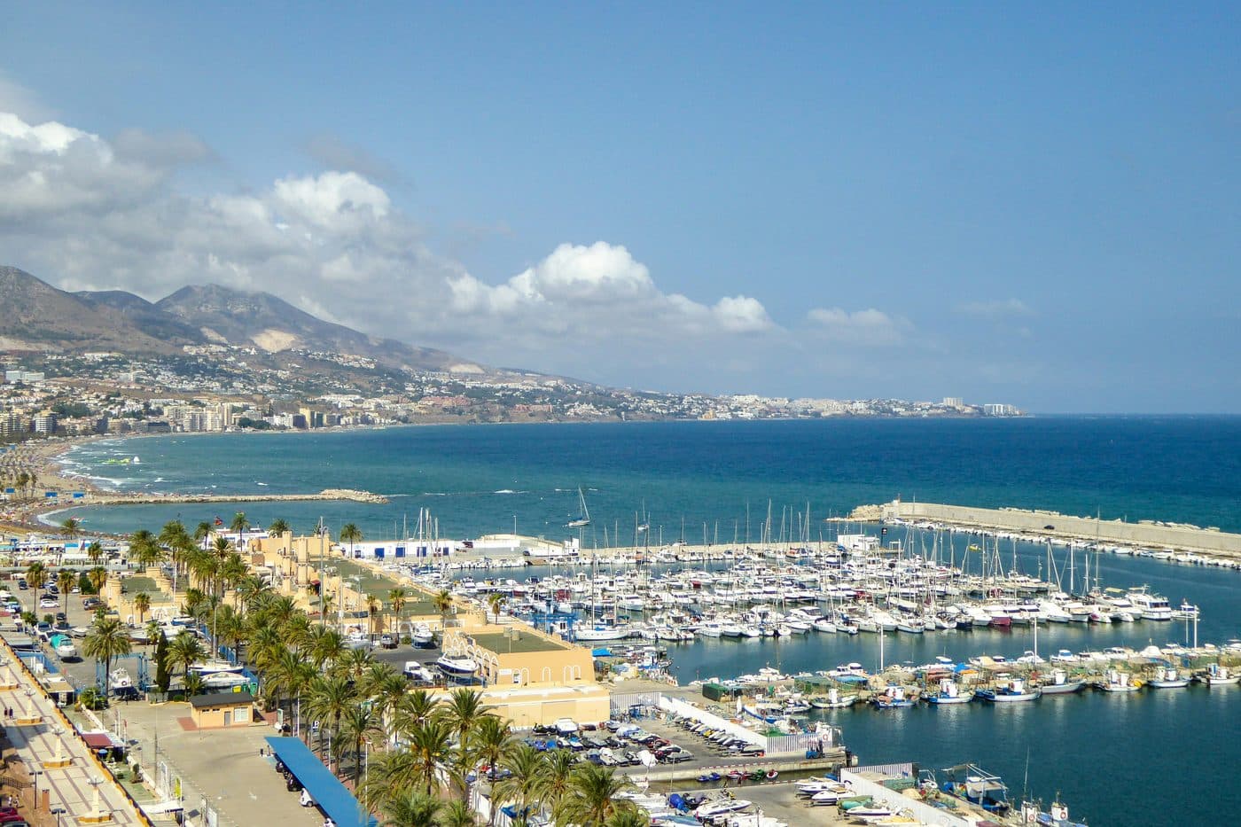 The Paseo Marítimo of Fuengirola with palm trees, beach and the Mediterranean
