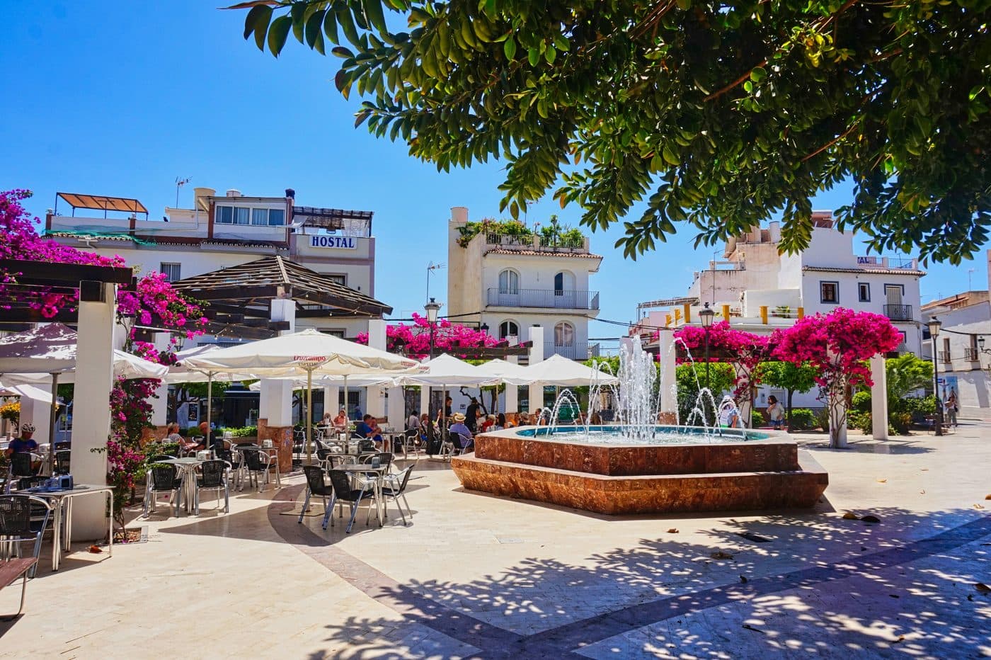 Burriana beach in Nerja with chiringuitos and swimmers